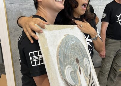 Gianna receiving the surprise gift of the artisans A.R.T. 2025