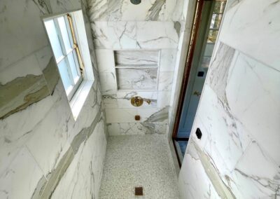 PYRAMID - 12x24 Calacatta Gold marble mosaic withsloped ceiling
