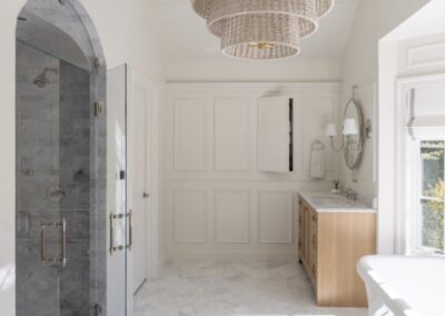 Photo courtesy of WINN Design Houzz- 3x6 marble in Asian Statuary from TileBar with 5x12 profile base skirting pencil chair rail frame subway with double arch vaulted ceiling with 6x12 Asian Statuary as diagonal herringbone marble on floor
