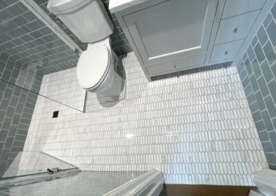 PYRAMID - marble picket mosaic floor curbless shower subway wall tile and wainscoting