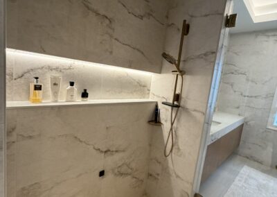 large format porcelain with Schluter trim with illuminated niche
