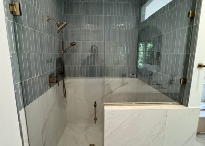 24" x 48" Porcelain Luxe White vertically stacked with Marin 2.5" x 10" Ceramic Misty Blue offset 50% with 0.5" x 12" Jolly Trim